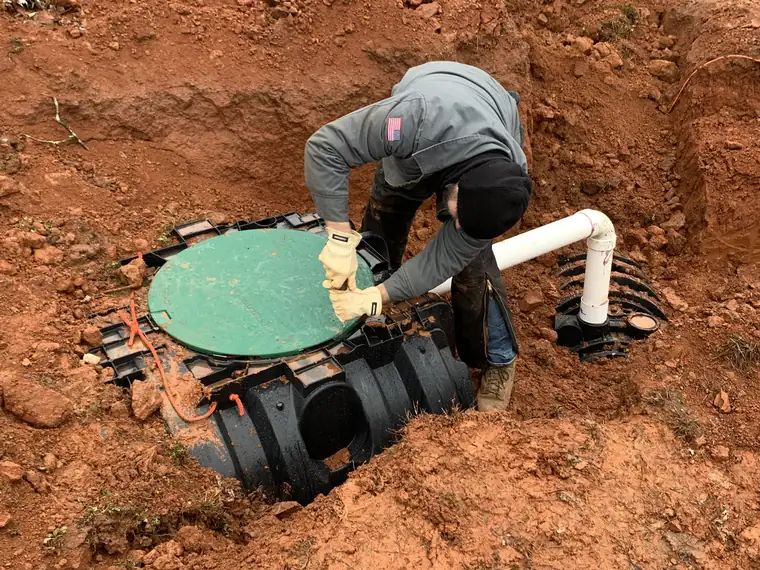 SepticRooter™ technician servicing a septic pump riser in Metro Atlanta, Georgia
