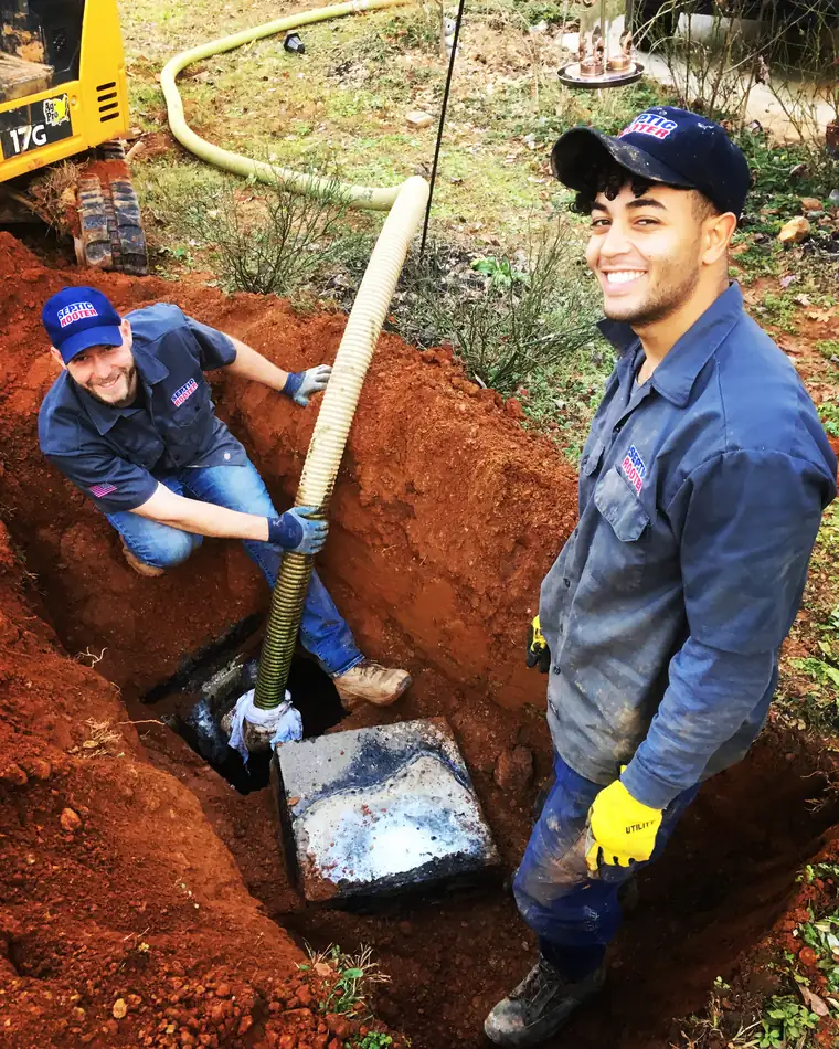 SepticRooter™ licensed technicians repairing a septic system in Metro Atlanta, Georgia